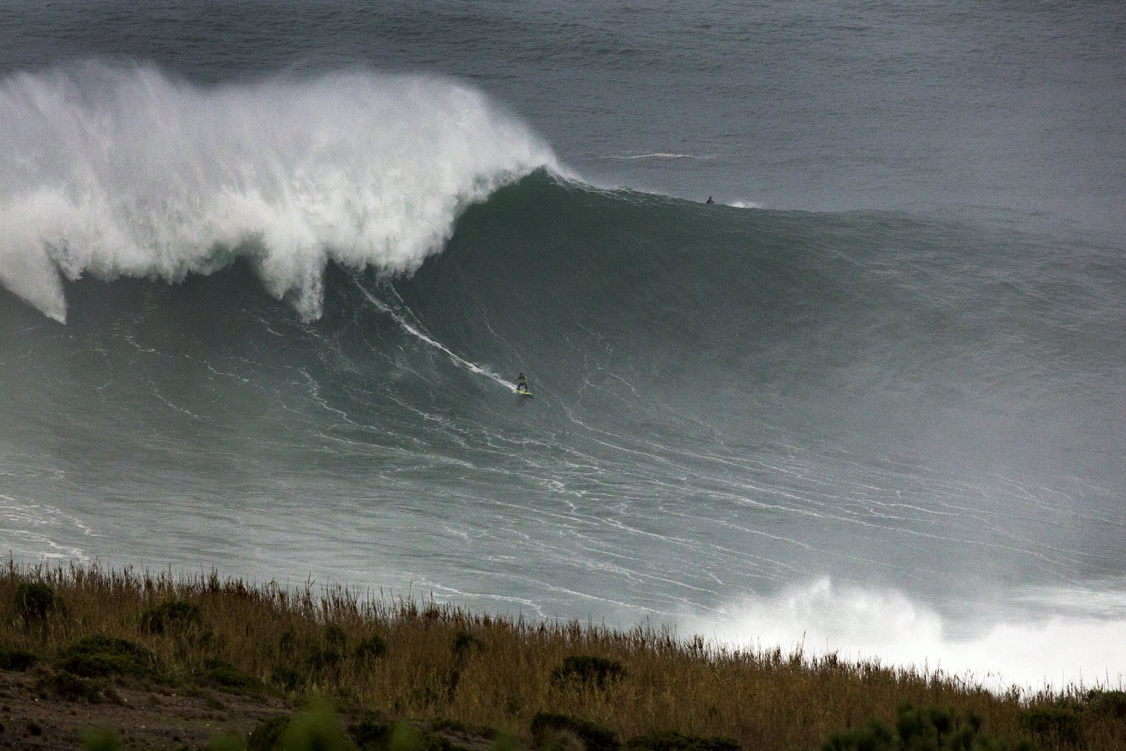 Carlos Burle surfs a big wave at Praia do Norte in Nazare, Portugal on November 01, 2015 // Hugo Silva/Red Bull Content Pool